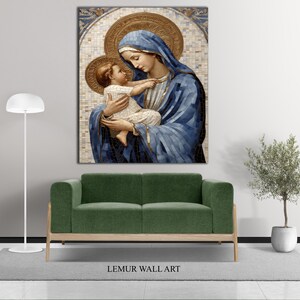 May include: A painting of a woman in a blue robe holding a child. The painting is framed and has a gold background.