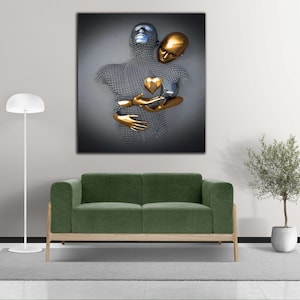 May include: Abstract art print featuring a silver and gold sculpture of two figures embracing. The figures are made of wire mesh and have a heart shape in the center of their chest.
