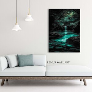 May include: A framed wall art print depicting a serene forest scene with a waterfall and a turquoise river. The artwork is displayed above a white sofa with a wooden frame. The text "LEMUR WALL ART" is visible.