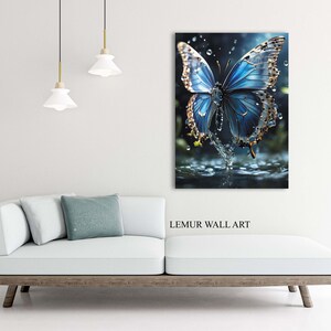 May include: A blue butterfly with gold accents is landing on a water surface. Water droplets are falling around the butterfly. The image is titled "LEMUR WALL ART".