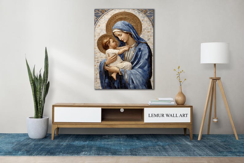 May include: A painting of the Virgin Mary holding a baby Jesus. The painting is done in a mosaic style with blue, gold, and white colors.