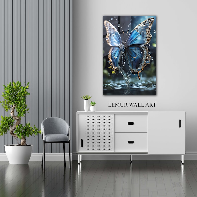 May include: A blue butterfly with iridescent wings emerges from a pool of water. The butterfly is surrounded by water droplets. The image is a glass wall art piece with the text "LEMUR WALL ART" below the image.