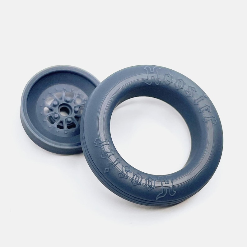 May include: A blue rubber ring with the words "HOSS" and "HOSS LIFE" embossed on it. The ring is designed to be used for training and exercise.