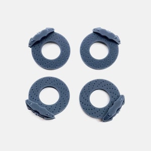 May include: Four blue brake rotors with brake calipers attached. The rotors are made of a textured material and have a circular shape. The calipers are attached to the rotors and have a curved shape.