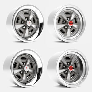 May include: Four classic car wheels with a silver rim and gray spokes. Each wheel has a red center cap with the letters "PMD" or a red arrowhead logo. The wheels are set against a white background.