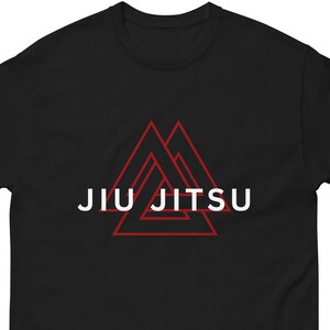 May include: Black t-shirt with a red triangle design and the text "JIU JITSU" in white.