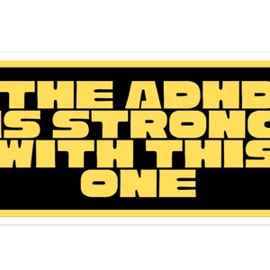 May include: A yellow sticker with black text that reads "THE ADHD IS STRONG WITH THIS ONE".