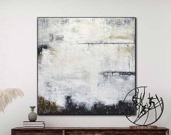 May include: A large abstract painting in shades of white, gray, and black hangs above a wooden dresser. A black metal sculpture of figures on a curved surface sits on the dresser.