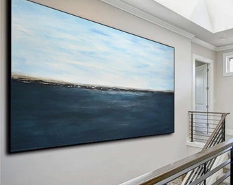 May include: Large rectangular abstract painting with a seascape theme. The artwork features a gradient of colors, with a light blue sky, a dark blue ocean, and a thin brown line representing the horizon.