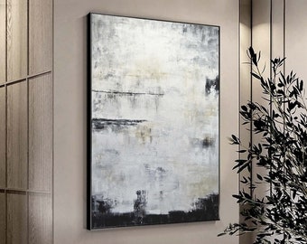 May include: Abstract painting with shades of gray, black, and white. The painting has a textured look and is framed in a black frame.
