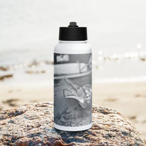 Cadillac Flying Goddess Stainless steel water bottle with a straw lid