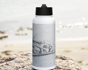 May include: White water bottle with a black lid and a black and white image of a vintage airplane with the text "B6" on the side.