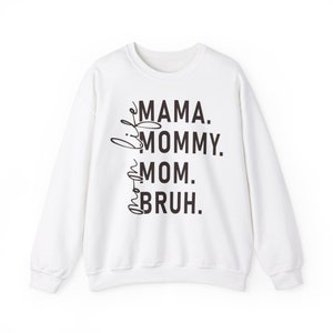 May include: White sweatshirt with black text that reads "Mama. Mommy. Mom.  Bruh."
