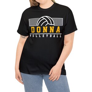 May include: Black t-shirt with a white volleyball and net graphic. The text "DONNA VOLLEYBALL" is in yellow.
