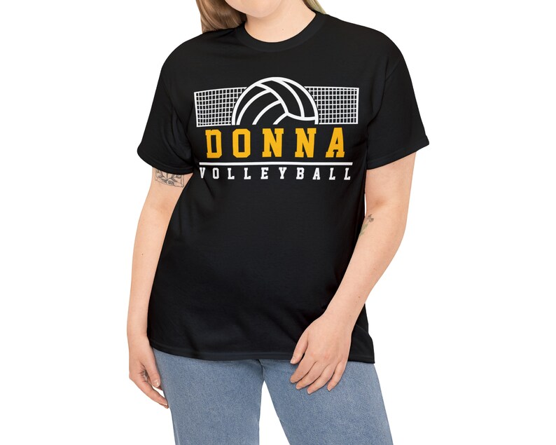 May include: Black t-shirt with a white volleyball and net graphic. The text "DONNA VOLLEYBALL" is in yellow.