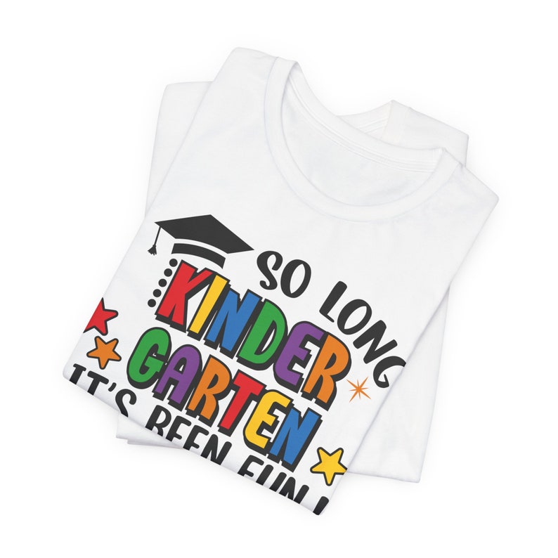 May include: White t-shirt with a colorful graphic that says "So long kindergarten it's been fun!" with a graduation cap and stars.