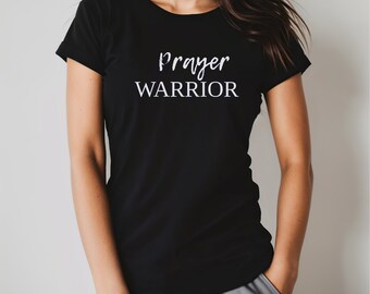 May include: Black t-shirt with white text that reads "Prayer Warrior".