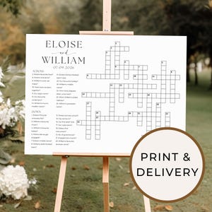 May include: A printable wedding crossword puzzle featuring the names Eloise and William, with the date 07.09.2026. The crossword puzzle is on a white background with black lines. The crossword puzzle is displayed on a wooden easel.