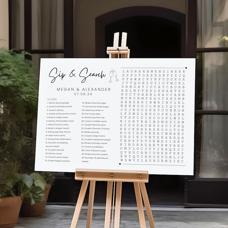 May include: A white printable sign with a black and white word search puzzle. The puzzle is titled "Sip & Search" and includes the names Megan and Alexander. The sign is on a wooden easel.