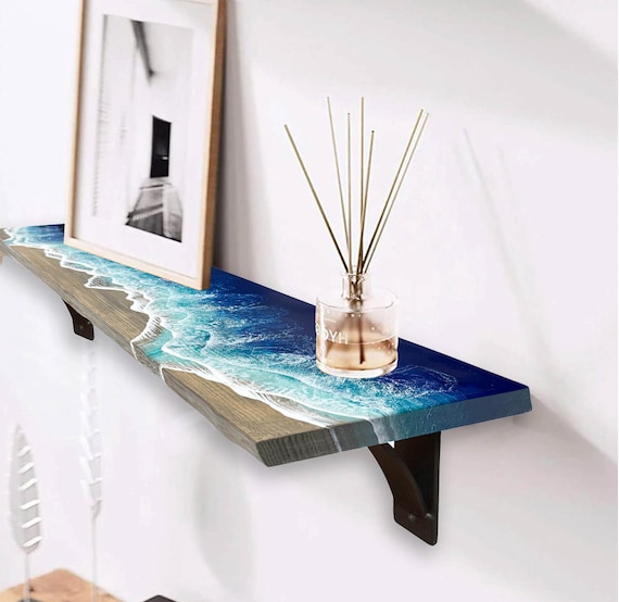 Ocean-wave resin rivers carved into live-edge wood make this a sculptural shelf that looks like it belongs in a gallery, not a hardware store.