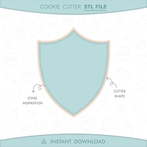 May include: A light blue shield-shaped cookie cutter design with a peach-coloured border. The image includes the text "COOKIE CUTTER STL FILE" and "INSTANT DOWNLOAD". Dotted lines point to "ICING INSPIRATION" and "CUTTER SHAPE".