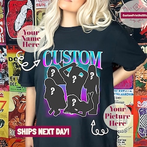May include: Black t-shirt featuring a graphic of five silhouettes of people with question marks on their heads. The text "CUSTOM" is above the silhouettes in a gradient of blue, purple, and pink. The text "Your Name Here" is in a white circle on the left side of the shirt. The text "Your Picture Here" is in a green circle on the right side of the shirt. The text "SHIPS NEXT DAY!" is at the bottom of the shirt.