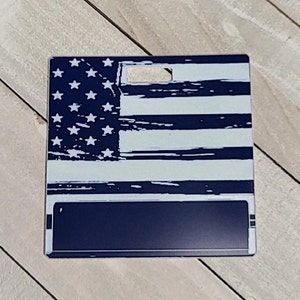 May include: A blue and white distressed American flag design on a metal sign with a blank space for personalization.