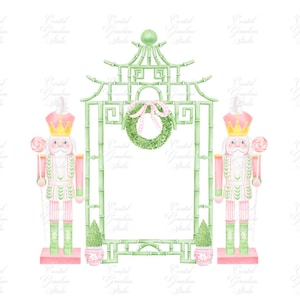 May include: Two pink and green nutcracker figurines stand on either side of a green bamboo-style frame with a green and white wreath with a pink bow. The frame has a white background.