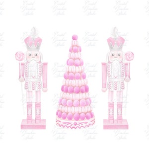 May include: Two pink nutcracker figurines holding candy canes stand on either side of a pink and white macaron tower.
