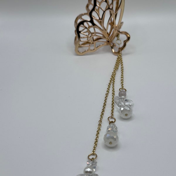 Detailed butterfly hair claw clip with chain charm.