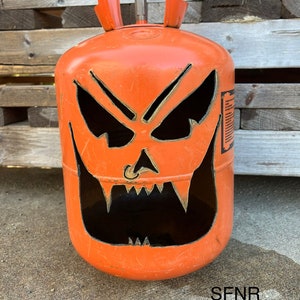 Upcycled Freon tank jack o’ lantern pumpkin yard or porch art for Halloween