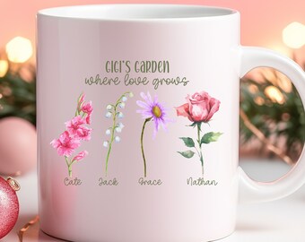 May include: White ceramic mug with a pink background and the text "Gigi's Garden where love grows".  Four watercolor flowers are depicted with the names "Cate", "Jack", "Grace", and "Nathan" underneath.