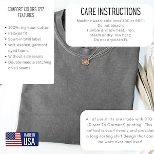 May include: A gray Comfort Colors 1717 t-shirt with a relaxed fit, made of 100% ring-spun cotton. Features include a sewn-in twill label, soft-washed fabric, and double-needle stitching. Care instructions and "Made in USA" label are visible.