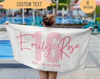 May include: White beach towel with pink text that says "Emily Rose 16" and "EST. 10.10.2008".