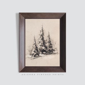 May include: A framed black and white sketch of three snow-covered pine trees. The artwork is in a dark brown frame and features the text "ARIZONA VINTAGE PRINTS" at the bottom.