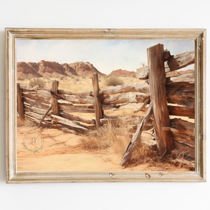 May include: A weathered wooden fence stretches across a desert landscape with red rock formations in the background. The fence is made of rough-hewn logs and is partially broken down. The desert floor is covered in sand and sparse vegetation.