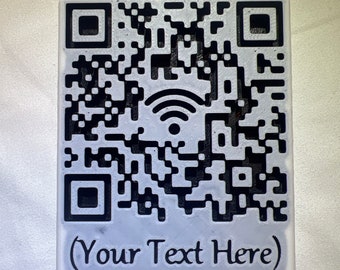 May include: White square tile with a black and white QR code and a Wi-Fi symbol. The tile has the text "(Your Text Here)" printed on it.