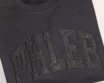 Camiseta o sudadera Phleb con purpurina negra sobre negra
