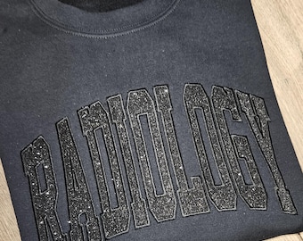 Camiseta o sudadera de radiología con brillantina negra sobre negra
