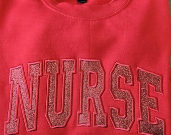 Sudadera de enfermera roja con purpurina roja