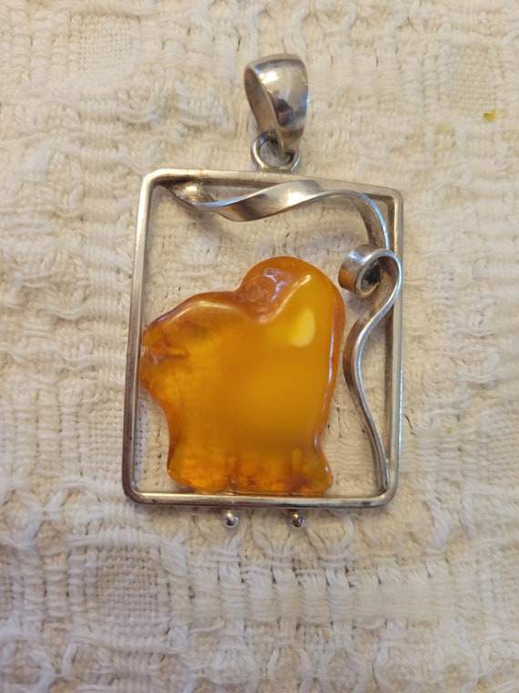 Silver and Russian amber pendant.  Artisan made.