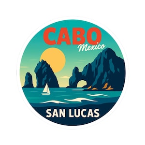 May include: A round sticker featuring a Cabo San Lucas, Mexico, design. The sticker has a teal background with a yellow sun, blue water, and dark blue rock formations. The text "CABO" is in orange, and "SAN LUCAS" is in white.