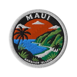 May include: A circular embroidered patch featuring a tropical landscape with a bright orange sunset, a blue ocean, green mountains, and a palm tree. The text MAUI is arched at the top and HAWAIIAN ISLANDS is arched at the bottom in white letters.