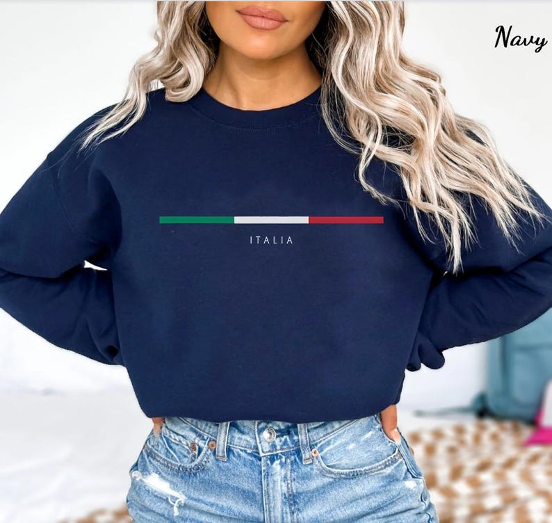 May include: Navy blue long-sleeved sweatshirt with a horizontal stripe of the Italian flag colors and the word "ITALIA" printed below the stripe.