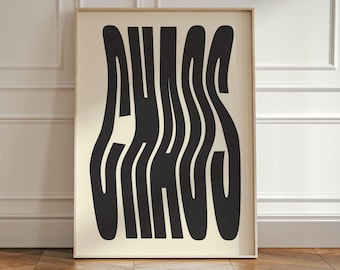 May include: A black and white print of the word "CHAOS" in a stylized, wavy font. The print is framed in a light wood frame and is hanging on a white wall.