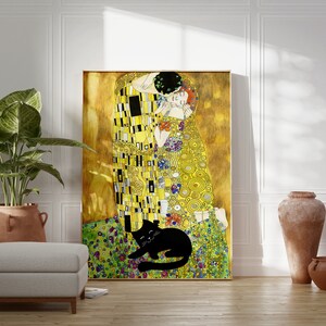 May include: A framed print of Gustav Klimt's "The Kiss" hangs on a white wall. A black cat rests on the green and purple floral foreground. A large potted plant, a footstool, and terracotta vases complete the scene.