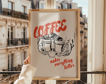 Może przedstawiać: Oprawiony wydruk z napisem "COFFEE" w czerwonym skrypcie nad czarno-białą ilustracją dwóch filiżanek kawy na tacy. Poniżej znajduje się czerwony napis "makes everything better".