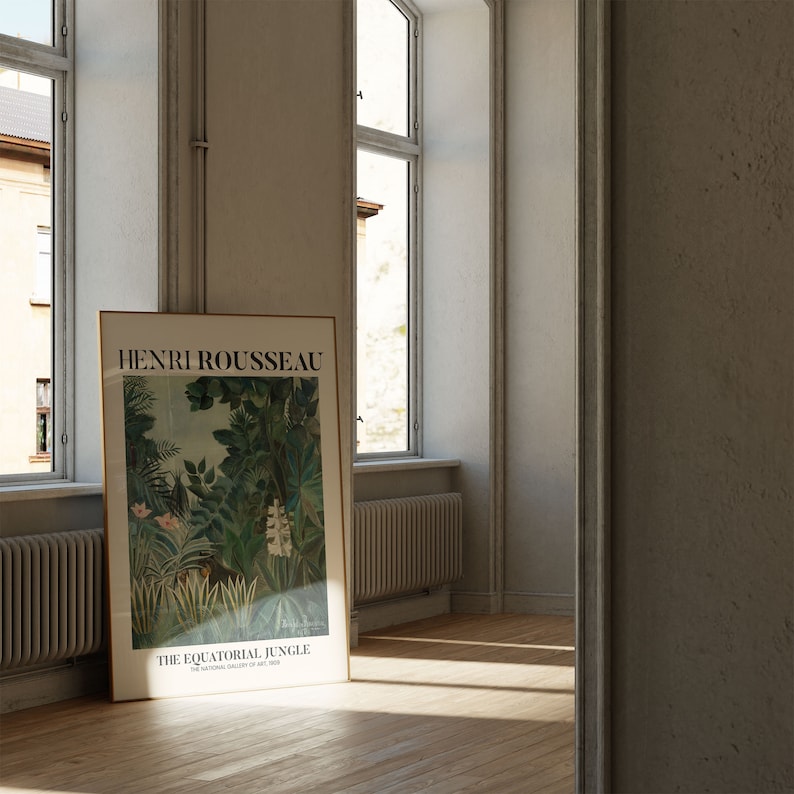 May include: A framed poster of a painting by Henri Rousseau titled "The Equatorial Jungle" featuring a lush green jungle scene with white flowers and a brown animal in the foreground.