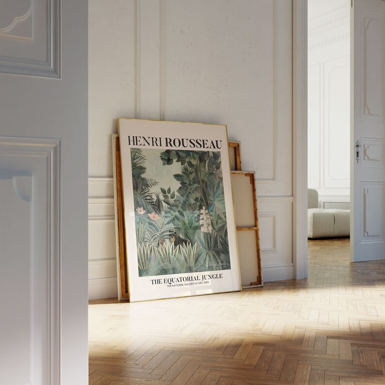 May include: A framed poster with a gold frame featuring a painting of a jungle scene with lush green foliage and a small animal. The poster is titled "Henri Rousseau, The Equatorial Jungle, The National Gallery of Art, 1909".