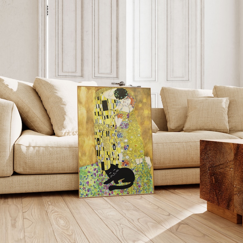 May include: A framed print of Gustav Klimt's "The Kiss" with a black cat illustration. The artwork features gold, yellow, and colorful floral patterns. The cat is lying down in front of the artwork.